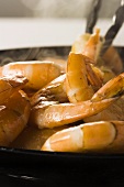 Prawns being fried in a pan