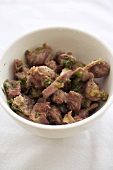 Bowl of Chicken Gizzards Sauteed with Spices and Shallots