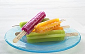 Assorted Popsicles on a Blue Plate