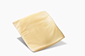 A Slice of White American Cheese on a White Background