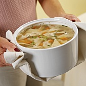 A Woman Carrying Kreplach in Chicken Soup