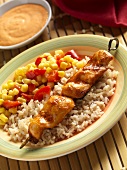 Skewered Chicken Tender with Roasted Red Pepper Sauce Over Rice