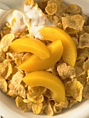 Corn Flake Cereal with Peach Slices and Milk