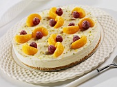 Frozen Key Lime Pie Topped with Mandarin Oranges and Raspberries