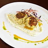 Herbed Crab Cakes Over Cheese Grits