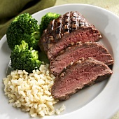 Rare Grilled Sirloin Steak Sliced with Rice and Broccoli