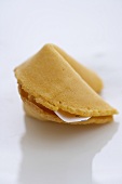 A Single Fortune Cookie on a White Background
