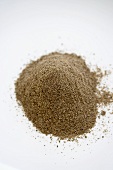 Pile of Cracked Chia Grain on a White Background