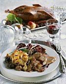 Dinner Plate of Roast Duck with Onions and Mushrooms; Red Wine
