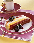 Slice of Layered Dessert Loaf with Berries and Sauce