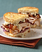 Turkey and Bacon Sandwich on Toasted White Bread; Halved