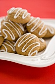Gingerbread Cookies with Icing Stacked on a Dish