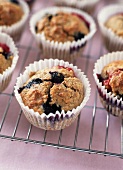 Blueberry Muffins in Paper Muffin Cups on a Cooling Rack