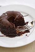 Partially Eaten Individual Chocolate Bundt Cake on a Plate, Fork