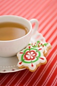 Cup of Tea with Two Christmas Cookies on Saucer