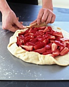 Chef Forming Crust for a Strawberry Tart