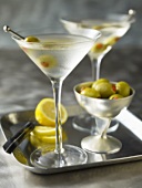 Two Martinis with olives on a tray