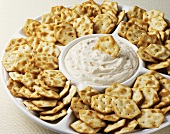 A Party Platter with Crackers and Onion Dip