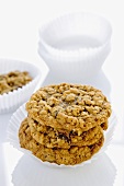 Three Oatmeal Cookies Stacked in a Paper Muffin Cup