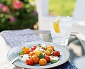 Cherry Tomato and Mozzarella Salad on an Outdoor Table