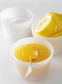 Lemon curd with sugar and squeezed lemons