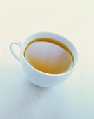 Cup of Green Tea on White