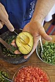 Man Slicing an Avocado in the Skin