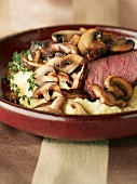 Steak and Mushrooms Over Mashed Potatoes
