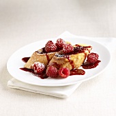 French Toast Topped with Raspberry Sauce and Raspberries
