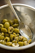 Green Olives in a Metal Bowl with Spoon