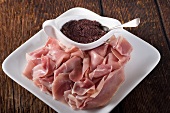 Sliced Prosciutto with Olive Tapenade