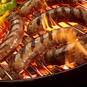 Grilled Bratwurst on Grill with Flames