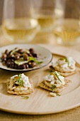Hummus and Cheese Crackers with Pine Nuts