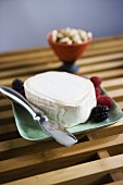 Brie Cheese on a Dish with Berries; Knife