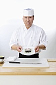 Sushi Chef with Prepared Ahi Tuna Rolls