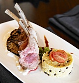 Rare Pork Chops with Fried Eggplant, Yogurt Sauce and Couscous Timbale