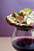 Salad of Figs, Pine Nuts and Sun Dried Tomato on a Glass of Wine