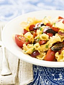 Pasta with Mushrooms and Tomatoes in a White Bowl