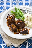 Barbecued Steak Tips with Mashed Potatoes and Beans