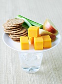 Healthy Snack on a Plate on a Glass of Water