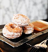Three Cinnamon Sugar Donuts on a Dish; Forks