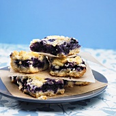 Blueberry Crumb Bars Stacked on a Plate