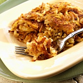 Hash Brown Potatoes on a Plate with Fork