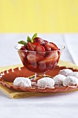 Bowl of Strawberries in Syrup with Wedding Cookies