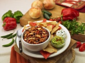 Bowl of Chili with Tortilla Chips, Guacamole and Sour Cream