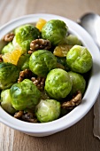 Brussels Sprouts with Orange and Walnuts in a Bowl