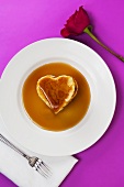 Heart Shaped Pancake with Maple Syrup on White Plate