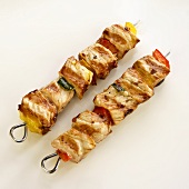 Two Grilled Pork and Pepper Skewers; White Background