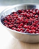 Cranberries in bowl of water