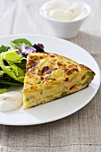 Potato tortilla with salad leaves